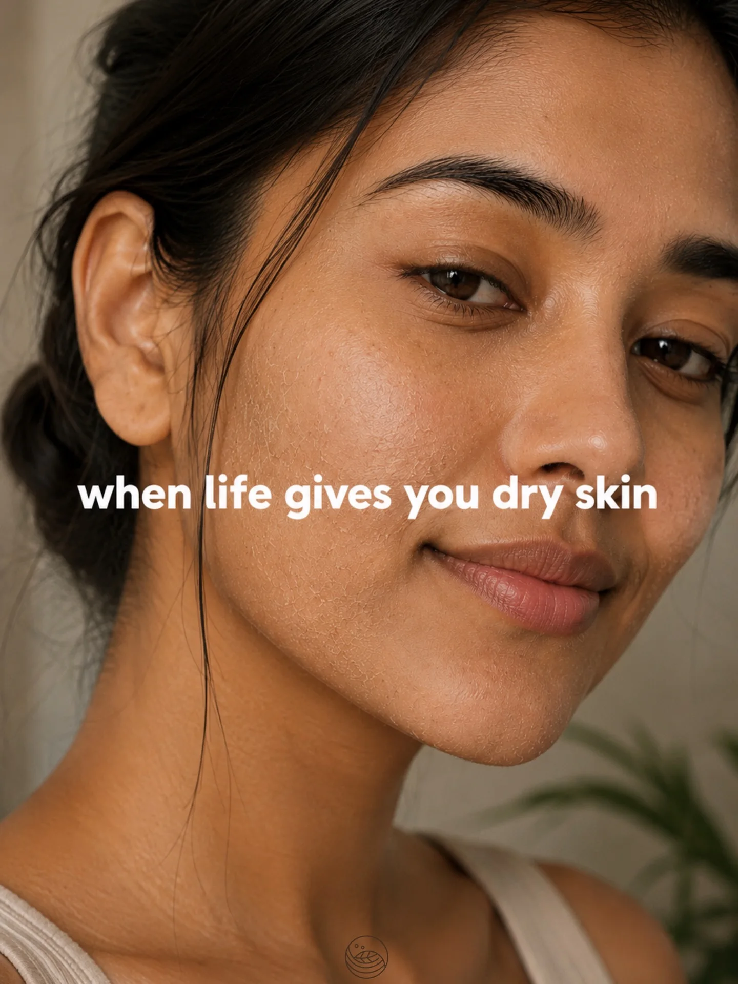 Portrait of a woman's face resting against her hand.