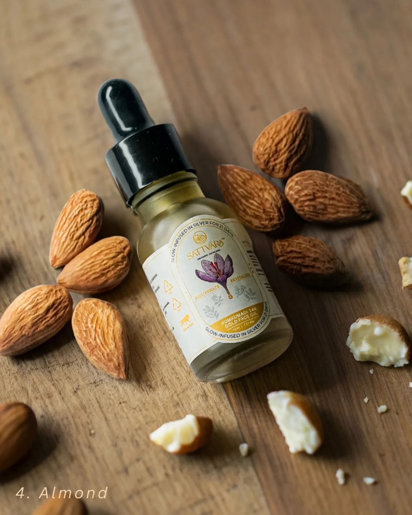 The Sattvāra face oil bottle beside a scatter of almonds.